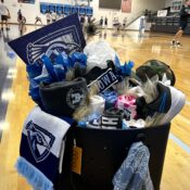 A gift basket filled with Peacock Athletics swag