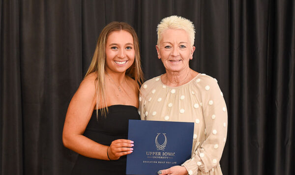 Julie Games of West Union, IA, presented the Martin & Julie Games Cheer & Dance Scholarship to 2025 recipient Madelyn Wolf of Atkins, IA