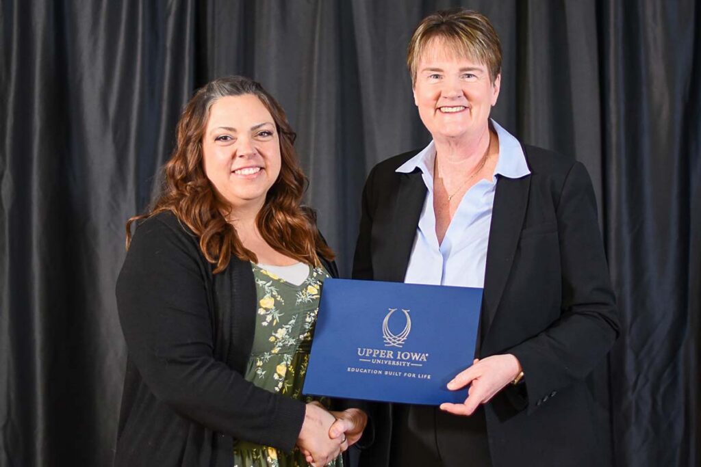 UIU President Kathy Franken is pictured presenting Jessica Patterson with the Bruce I. Campbell Endowed Scholarship.