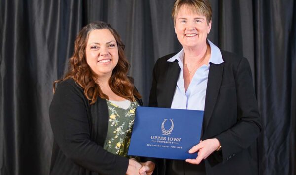 UIU President Kathy Franken is pictured presenting Jessica Patterson with the Bruce I. Campbell Endowed Scholarship.