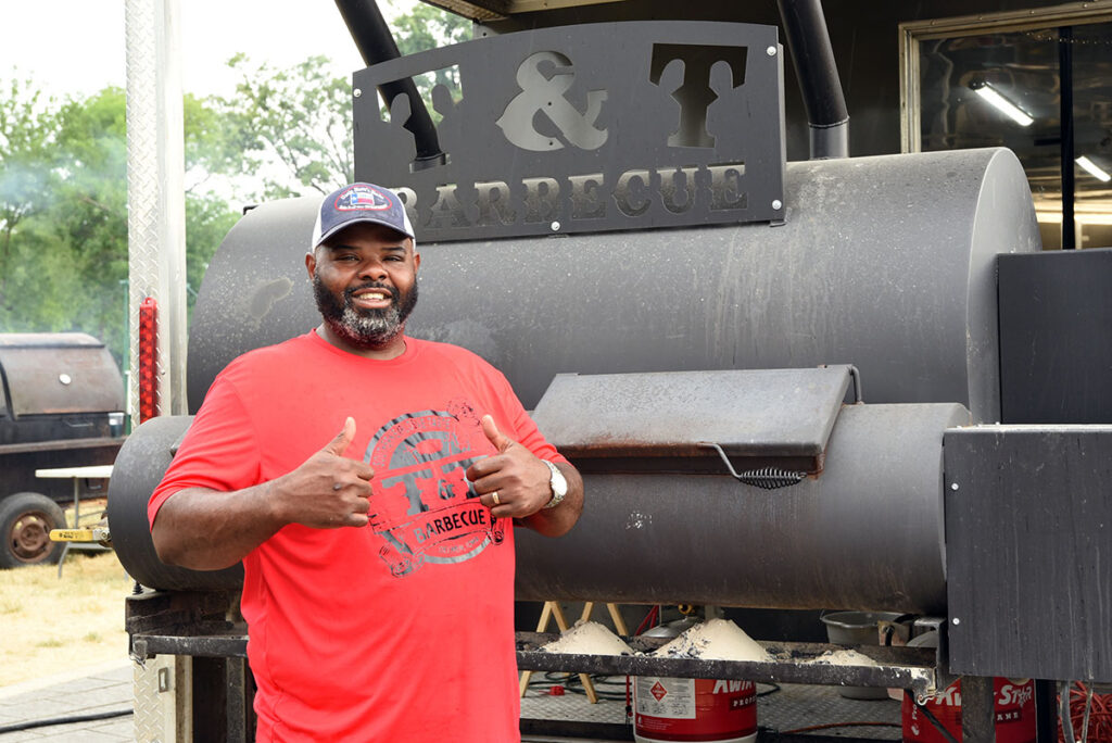 Thyron Mathews in front of his BBQ