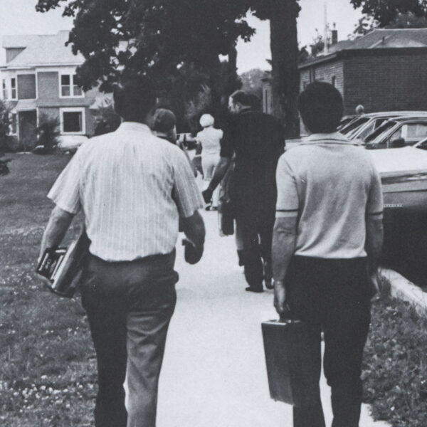 UIU adult learners walk to and from class with books in hand circa 1975