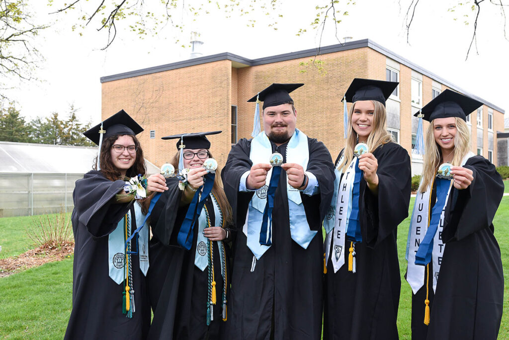 Csomay honors students pose with their medallions at graduation