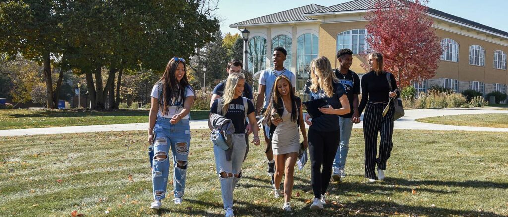 UIU students walking in autumn on the Fayette campus