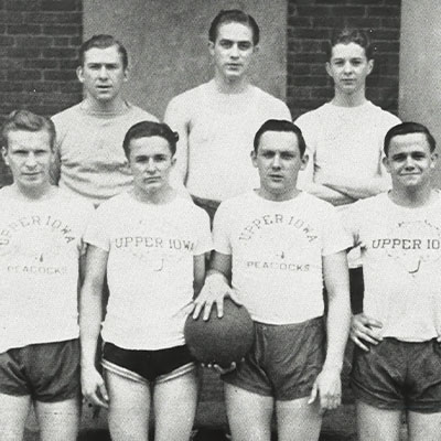 A black and white photo of an early UIU basketball team