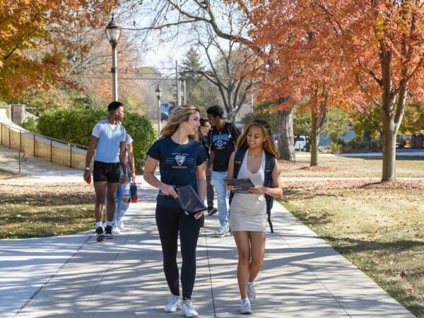 UIU students walking in autumn on the Fayette campus