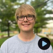 Headshot of Marcus Evans with video play preview button