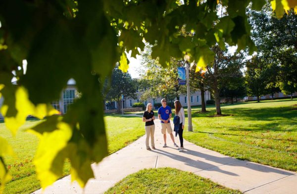 students touring main UIU campus in Fayette with tour guide